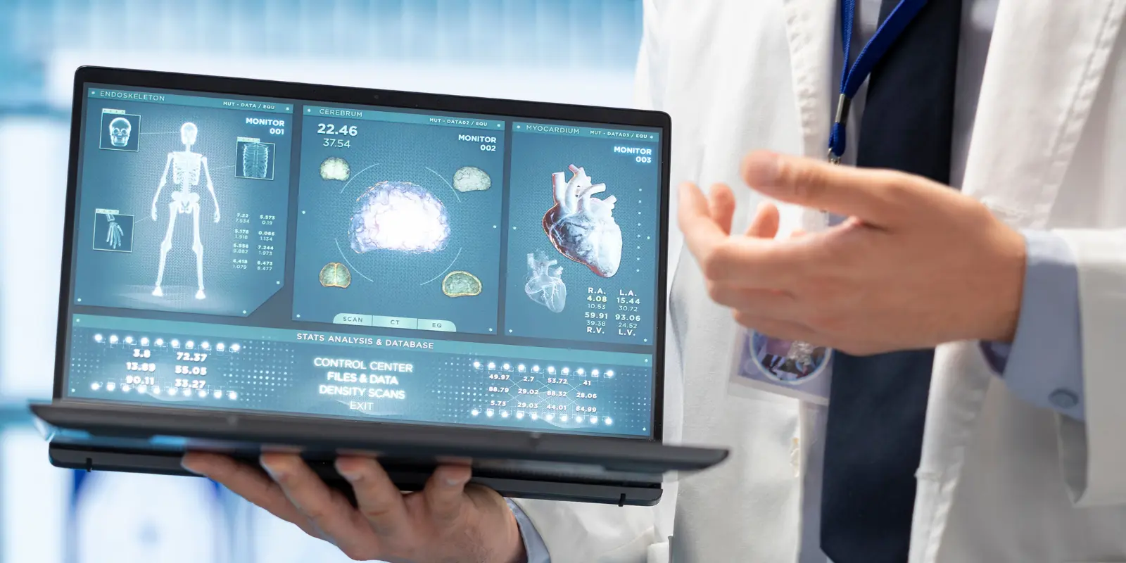Online MRI Reporting by Doctor on Laptop Doctor holding laptop displaying online MRI reporting.